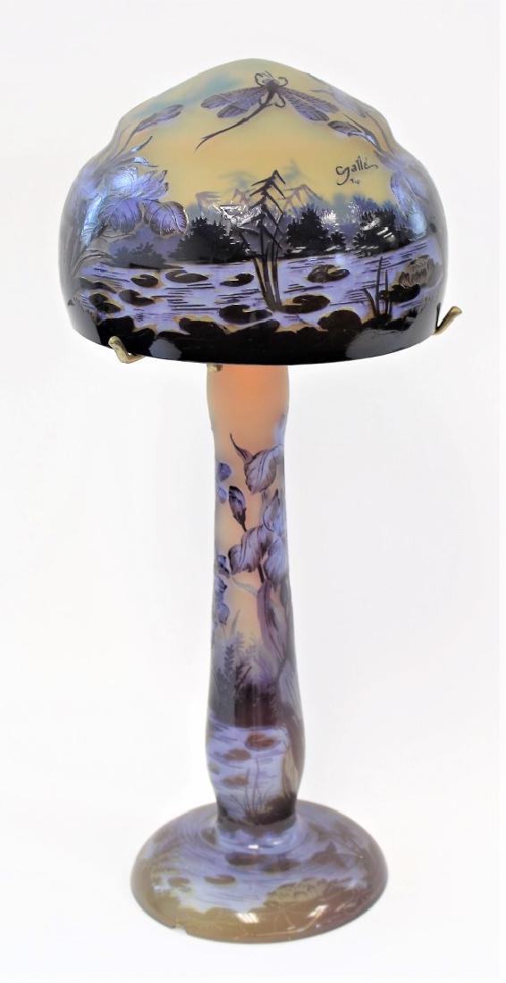 Galle Style Cameo Glass Lamp: Wheel cut and polished cameo glass mushroom lamp. Depicting dragonflies over a marsh landscape; 22in.H. x 9.5in.D.(shade)