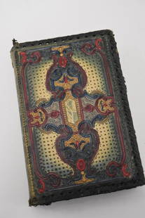 Hand Tooled Leather Book Cover: Elaborately hand tooled and decorated leather book cover; 9in. X 6in.