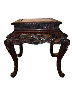 19thC. Japanese Heavily Carved Teakwood Table: Heavily carved teakwood table. Carved reticulated floral and bird design; 29.5in.H. x 30in.W. x 23.5in.(top width)