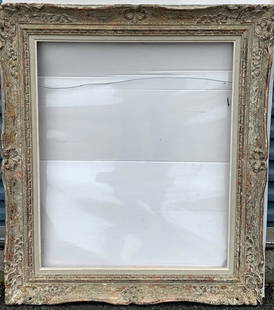 American Hand Carved and Gilt Wood Frame: Hand carved wood frame. White washed and gilt finish; 30.25in. X 25in.(opening), 39in. X 33in.(overall)