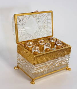 Ornate Brass and Glass Dresser Box: Brass and glass dresser box. Dome-top pressed glass lid. Fitted interior with six(6)perfumes. Brass mounts and claw feet; 5.75in.H. x 7in.W. x 4.5in.D.