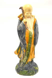 Chinese Glazed Ceramic Figure of an Elder: Glazed pceramic figure. Standing Elder. Marked on reverse; 25in.H. x 9in.W.