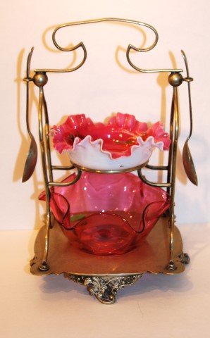 Victorian Silverplate Condiment: Silverplate two(2) tier condiment with glass inserts. Two(2) silverplate spoons;11in. H. x 6.5in. W.