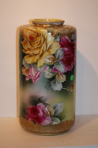 Nippon Porcelain Vase Signed: Hand painted porcelain vase. Rose decoration with gilt trim. Marked at underside; 15in. H. x 7.5in. D.(hairline crack at the bottom)