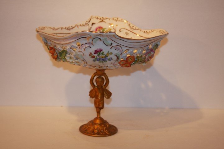 Dresden Porcelain Compote: Hand painted, reticulated porcelain compote with bronzed figure metal base; 8.25in. H. x 10in. W.