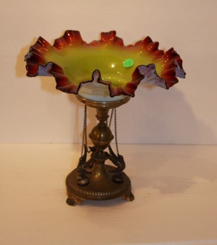 Victorian Silverplate and Glass Compote: Ravena Verde glass ruffled edge bowl. Silverplate holder with bird decoration; 10in. H. x 10in. D.