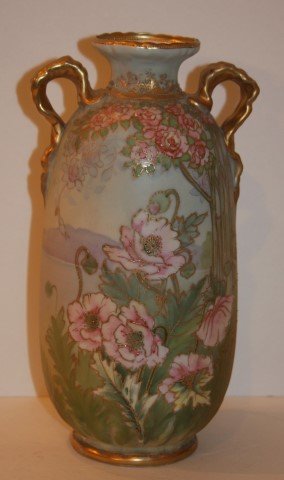 Nippon Porcelain Vase Signed: Hand painted and gilt porcelain vase. Double handled. Woodland setting with floral decoration; 11in. H. x 6in. W.