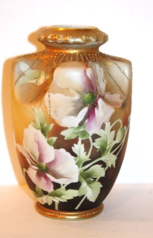 Nippon Porcelain Vase: Hand painted porcelain vase. Floral decoration; 8.5in. H. x 5.5in. W.