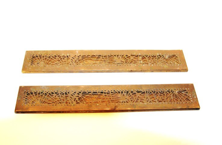 Pair of Tiffany Studios Brass Blotter Ends: Impressed Tiffany Studios New York. Numbered 998; 12in. L. x 2in. W.