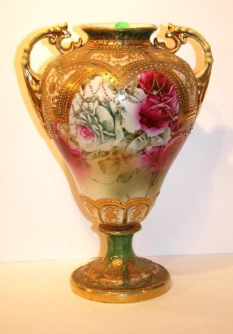 Nippon Porcelain Pedestal Vase: Two(2) piece porcelain pedestal vase. Hand painted rose, gilt and enameled decoration. Marked at the underside; 12.5in. H. x 8.5in. W.