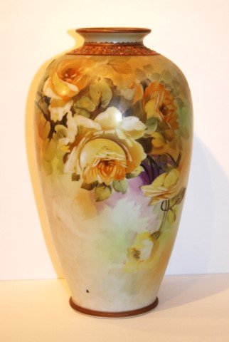Nippon Porcelain Vase Signed: Hand painted vase. Rose decoration. Marked at the underside; 11.5in. H. x 5.5in.