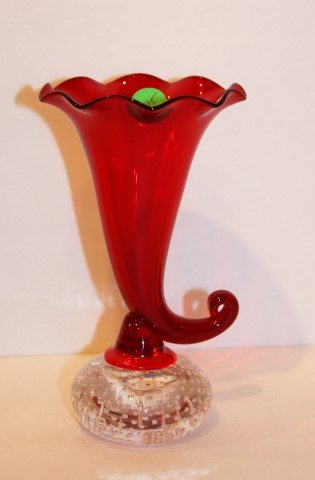 Pairpoint Glass Cornucopia: Cranberry glass cornucopia. Controlled bubble base; 7in. H. x 4in. W.