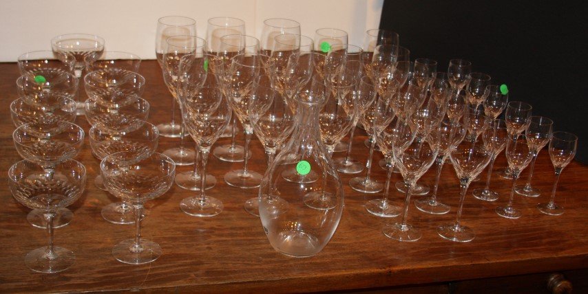 Orrefors 48 Piece Crystal Stemware: Comprised of twelve(12) each: cordials, water, white wine. Eleven(11) champagnes and decanter.