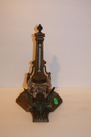 19th C. Bronzed Eygptian Revival Inkwell: Bronzed inkwell with thermometer. Eygptian Revivial motif; 9in. H. x 5in. W.