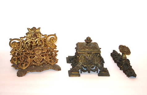 Three(3) Pieces: Miscellaneous Metalware: Victorian ornate bronze inkwell, Bacchus head, 4.5in. H. x 5.75in. W.; Bronzed cast iron ornate letter holder with winged cupid crest, 6in. H. x 7in. W.; Rococo bronze door handle, 8.5in. H.