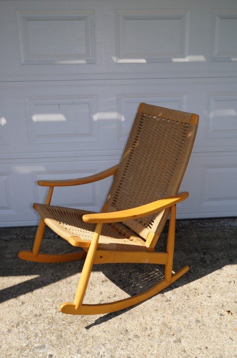 Hans Wegner Style Mid Century Rocking Chair: Blonde wood frame. Rope weave back and seat; 37in.H. x 24in.W. x 32in.D.