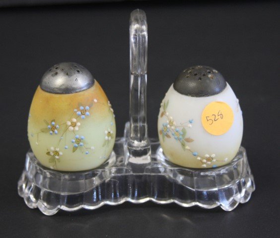 Victorian Glass Sat and Peppers: Enameled egg shaped glass salt and peppers. Presssed glass holder; 2.5in. X 2in.(shakers), 4.25in.H. x 5.5in.W.(holder)