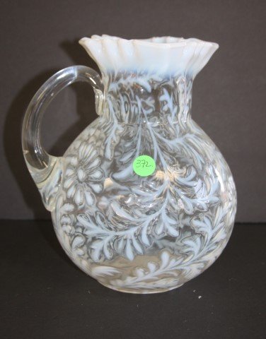 Northwood White Glass Pitcher: Victorian white glass pitcher. Daisy and fern pattern; 9in.H. x 7.5in.W.