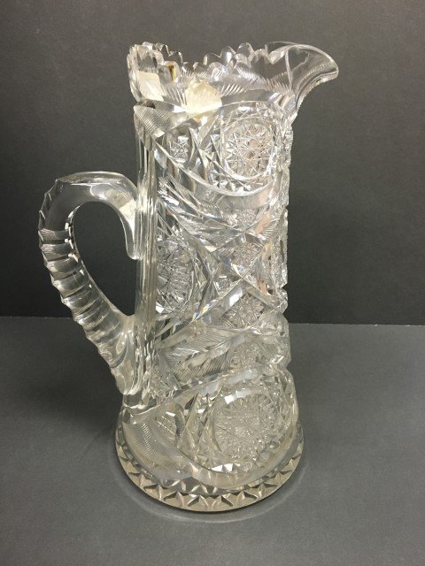 Cut Glass Intaglio Cut Water Pitcher: cut pinwheel designs, intaglio cut, size 12.75 h., 7.5 w.