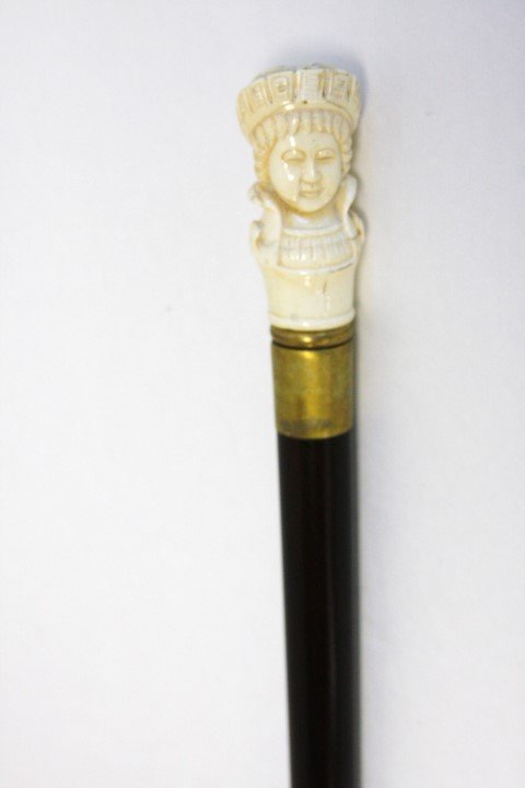 Walking Cane with Woman's Head Bone Top: 20th c., size 36.5 in. length, 1.5 in. dia. Top