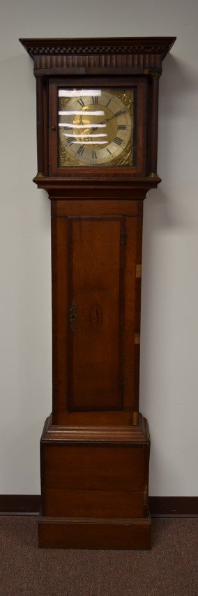 18thC. Thomas Webb Tall Cased Clock: Inlaid tall cased clock. Single weight and pendulum. Banded inlay and repoussed two tone brass dial with bas relief figures. Marked Thomas Webb, Wellington; 77.5in.H. x 21in.W.