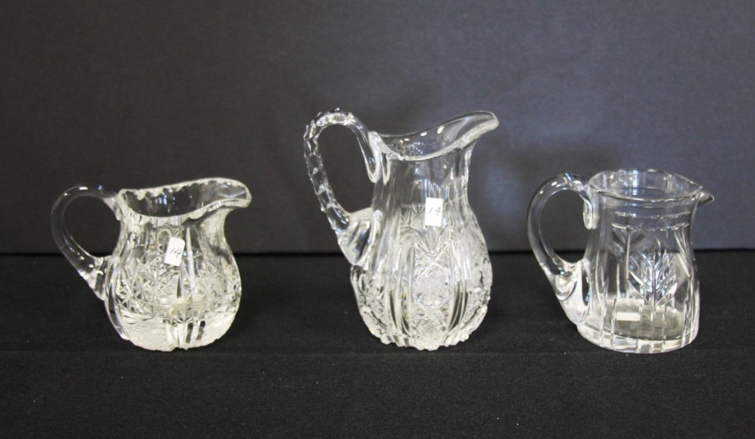 Three(3) Miniature Cut Glass Creamers: Three(3) cut glass creamers. One(1) marked Made in England; 2.5in. - 3.5in.H.