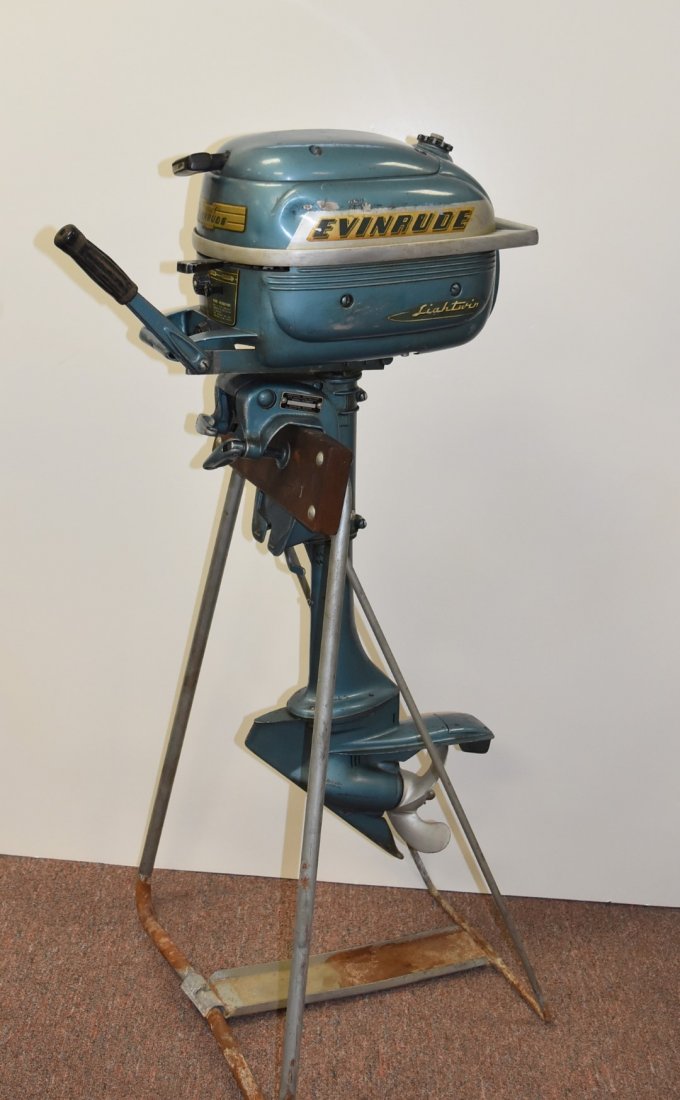 Vintage Evinrude Lightwin Outboard Motor: 3HP outboard motor. Serial No. 3012-15885. Iron stand; 36in.H. x 21in.W.