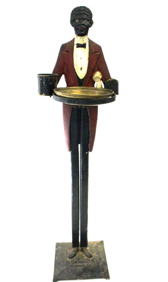 Black Americana Cast Iron Smoke Stand: Painted cast iron figural smoke stand. Brass ashtray insert. Marked: Patent Applied For at the base; 34in.H. x 9in.W. x 7.5in.(base)