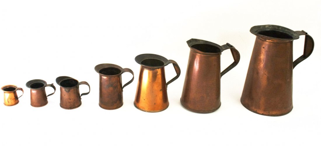Seven(7) Early Copper Pitchers (1 of 5)
