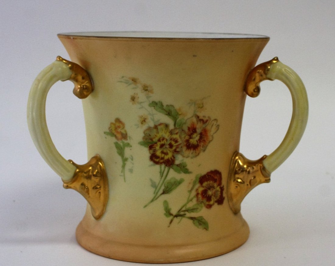 Royal Worcester Rudolstadt Loving Cup: Royal Worcester Rudolstadt 3 handled loving cup, floral and gold decoration all around. Size: 5.25 in. height, 6.25 in. wide.