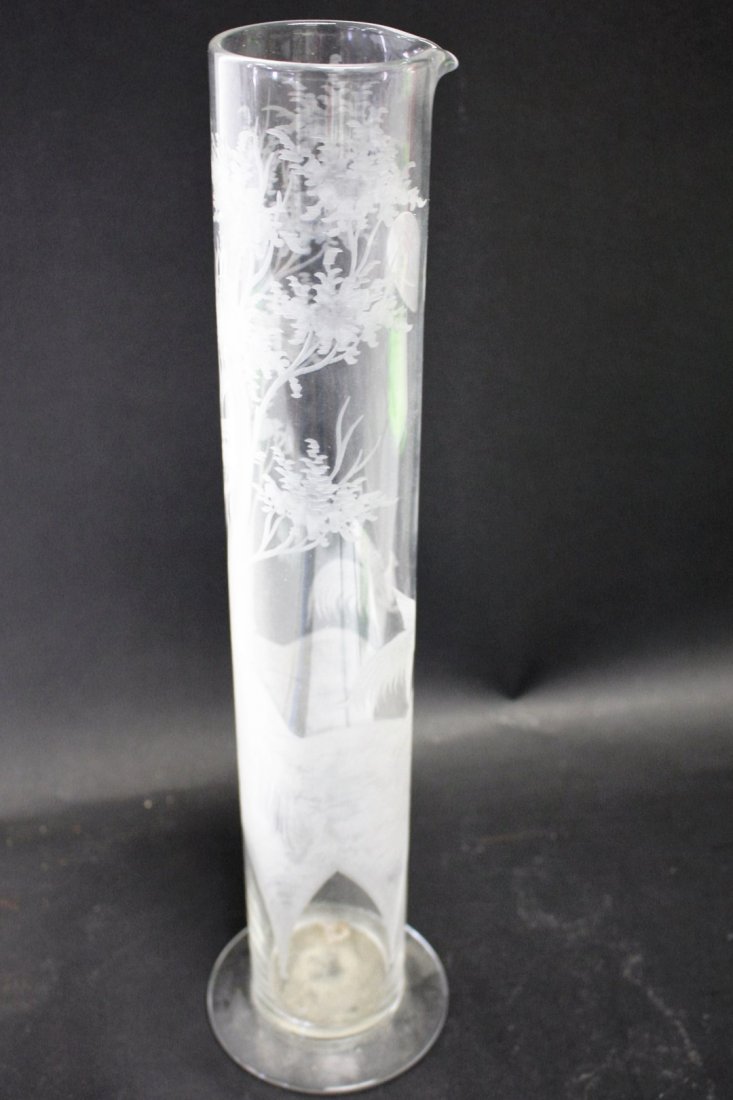 Etched Glass Beaker: Tall etched narrow glass beaker, etched trees, birds, sun. Size: 16.75 in height, 4.25 in. wide at base.