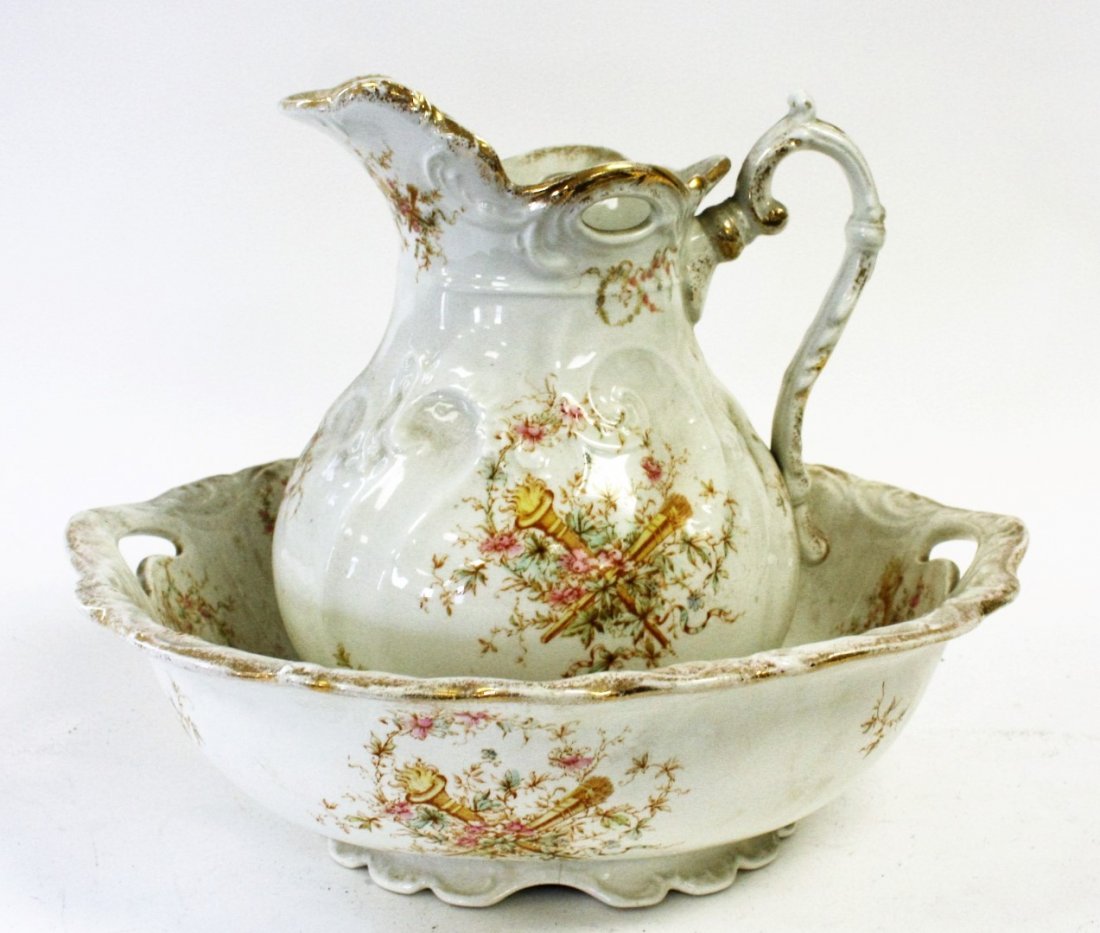 Maddock's Ironstone Pitcher And Bowl: Victorian ironstone pitcher and wash bowl, Maddock's, floral decoration. Size: 13 in. height, 15 in. wide.