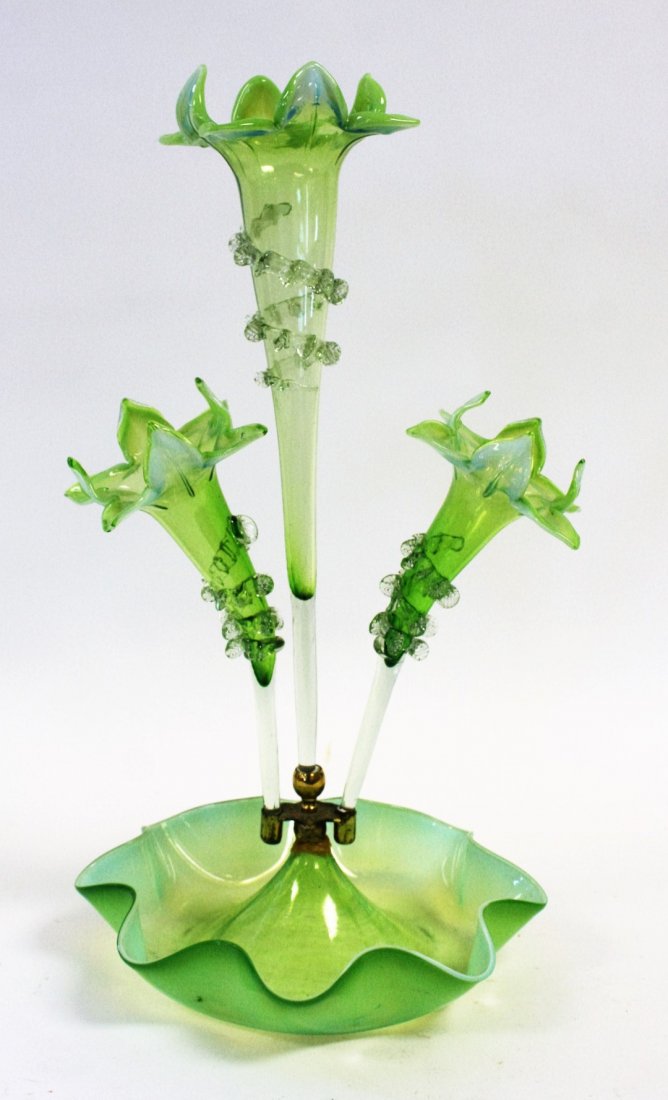 Victorian Green Opalescent Glass Epergne: Victorian green opalescent glass epergne, center fluted stem vase with 2 outer stem vases mounted on a glass base. Base holder shows strenghthening at cluster. All the glass is in good condition. Size