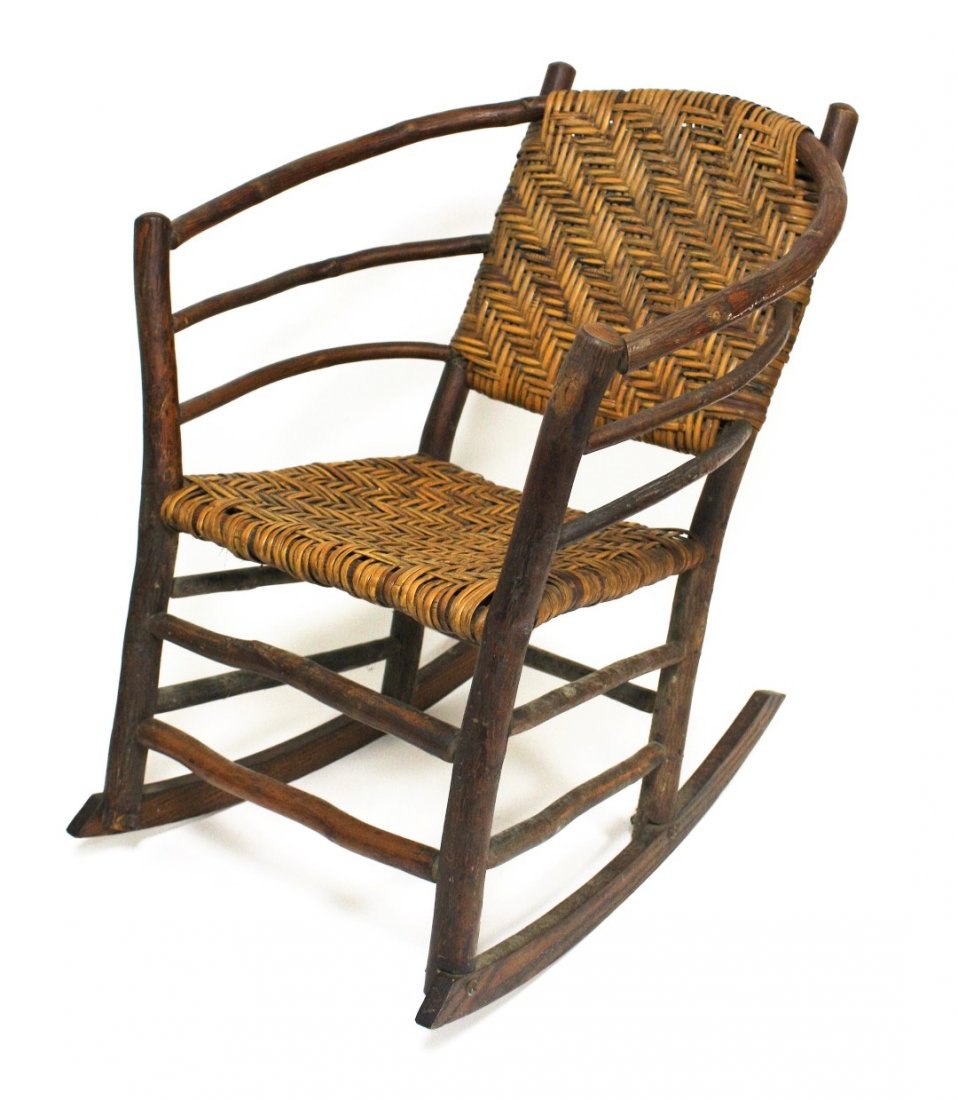 Indiana Hickory Rocker: Bentwood hickory rocker. Slint reed wicker seat and back. Marked Indiana Hickory; 31in.H. x 25in.W. x 24in.D.