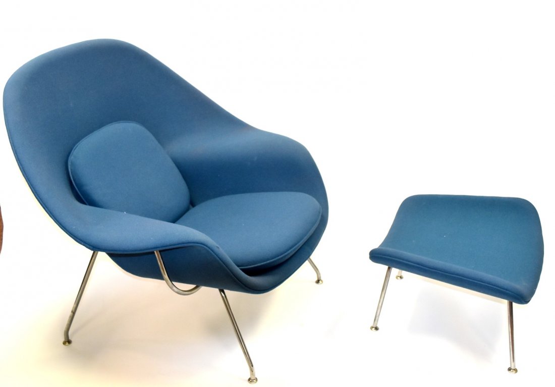Eero Saarinen Mid Century Womb Chair and Ottoman: Molded and blue wool upholstered womb chair and ottoman. Polished chrome construction. Designed by Eero Saarinen for Knoll; 35.5in.H. x 40in.W. x 34in.D.(chair), 14in.H. x 25in.W. x 19in.D.(ottoman)