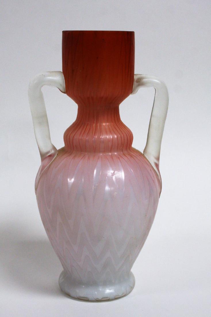 Victorian Opalescent Satin Glass Vase: Opalescent satin glass vase. Herringbone design. Applied glass handles; 8in.H. x 4in.W.