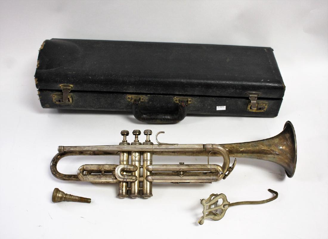 Carl Fisher Czechoslavakian Silvered Trumpet: Carl Fisher Zephr silvered trumpet. Mouthpiece and original case. Music holder; 19.25in.L. x 4.25in.D.(horn opening)