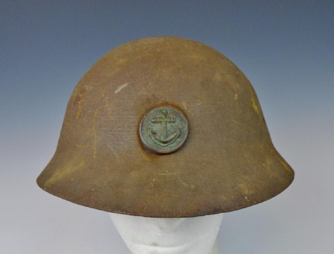 WW2 Japanese Type 90 Navy Landing Forces Helmet: WW2 Original Type 90 combat helmet shell with hand applied tan paint with attached Navy Landing Forces anchor insignia.