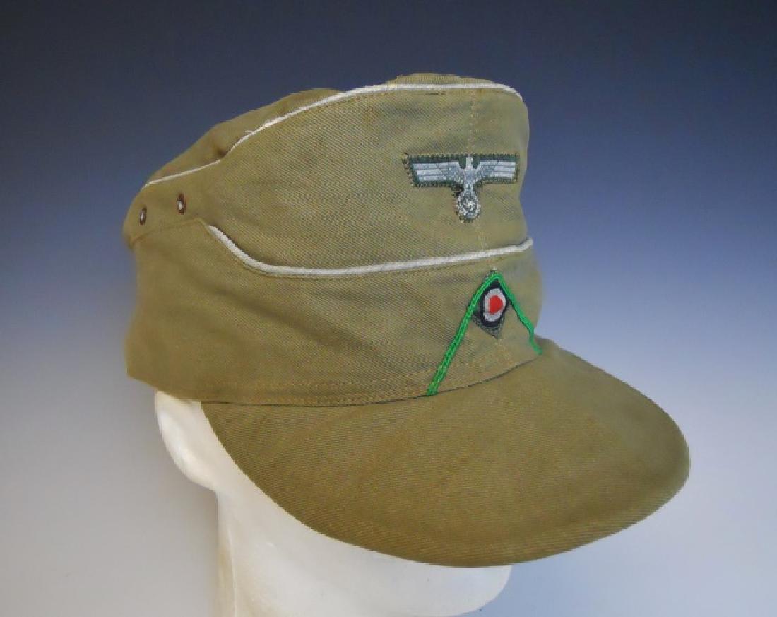 WW2 German DAK Panzer Grenadier Officer Cap: WW2 Original Deutsches Afrika Korps, Panzer Grenadier Officer cap. Ribbed cotton construction with silver (faded) piping and machine stitched eagle and cockade insignia with green waffenfarbe denoting