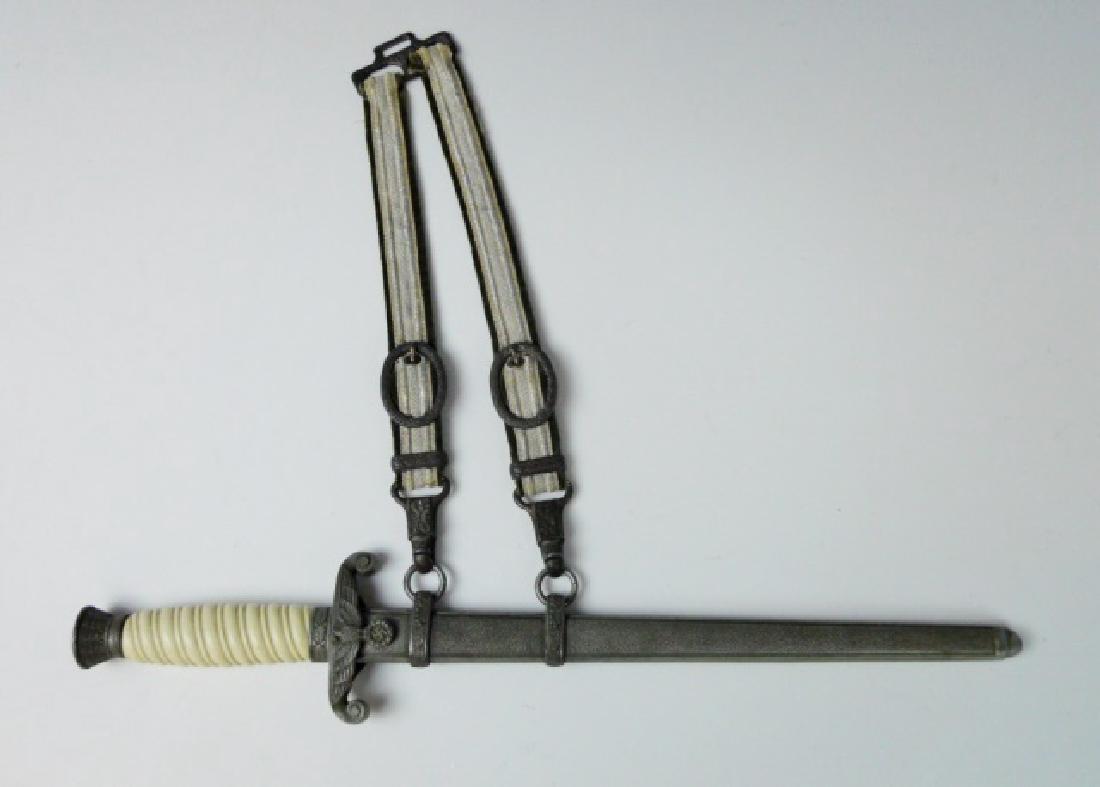 WW2 German M1935 Heer Dress Dagger, WKC: WW2 Original late production M1935 Heer officer's dress dagger. Steel blade with etched maker mark "WKC". White celluliod over wood spiral grip with oak leaf decorated pommel and ferule, cross guard w