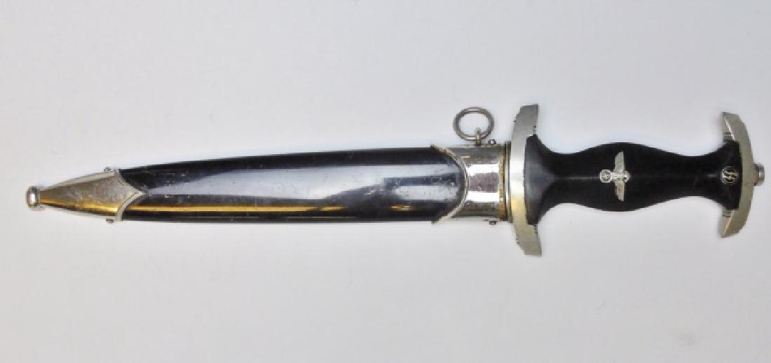 WW2 German M1933 SS EM/NCO Dress Dagger, KLAAS: WW2 Original M1933 SS EM/NCO Dagger. Steel blade etched "Meine Ehre Heist Treue" with etched maker mark "ROBERT KLAAS SOLINGEN". Solid nickel guard having "I" group mark, wood grip with inset eagle wi