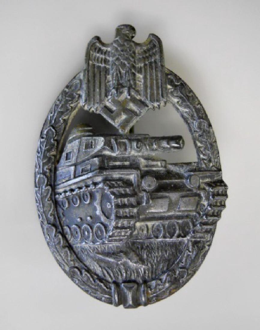 WW2 German Panzer Combat Badge, Karl Wurster: WW2 Original German Panzer combat badge in silver, Karl Wurster. Die struck badge with brass pin, hinge and catch. Reverse with stylized maker monogram upper left. Light wear consistent with age and u