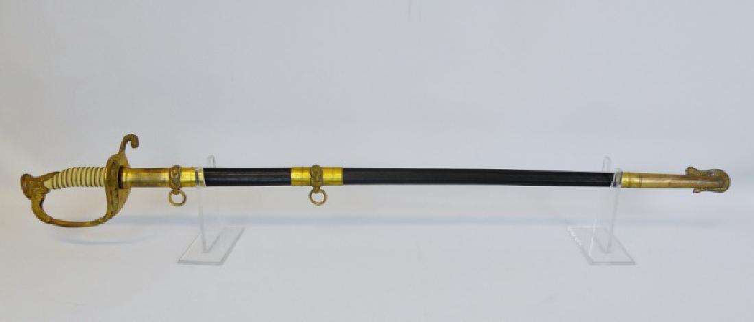 WWI-II US Navy Officer Sword, John Adams Jostyn: WW1-2 Era U.S. Navy officer's sword with engraved personalization, "John Adams Jostyn" Gilt metal figural hilt with "USN" foliate reticulated guard and wire wrapped synthetic white same grip. Straight