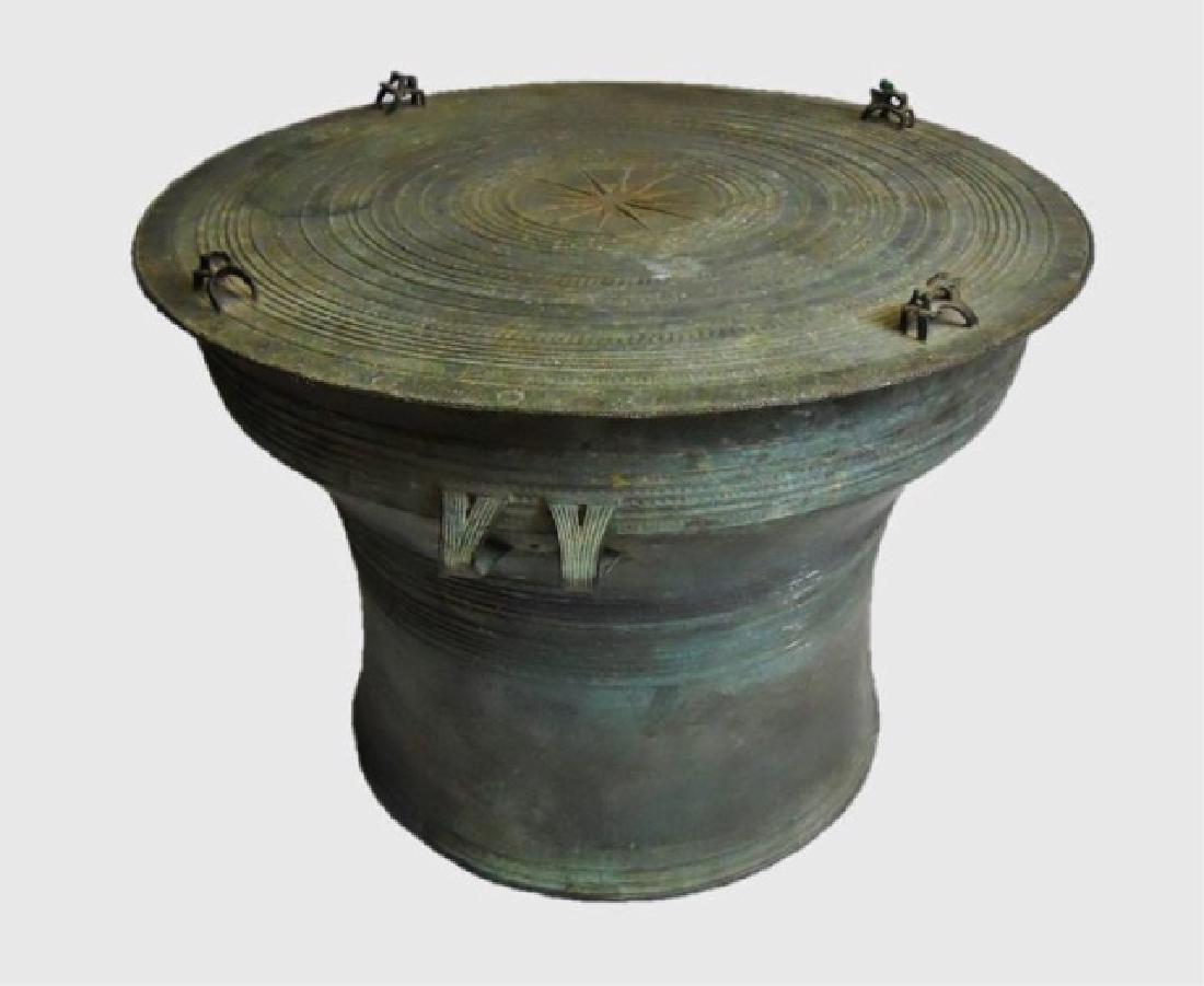 Antique Bronze Thai Rain Drum, Large Size: Herger type II bronze rain drum with four double frog figures, central twelve-point star decoration, and profuse stamped designs at top and sides. Deep verdigris patina. Measures 18" H x 25.25" D.