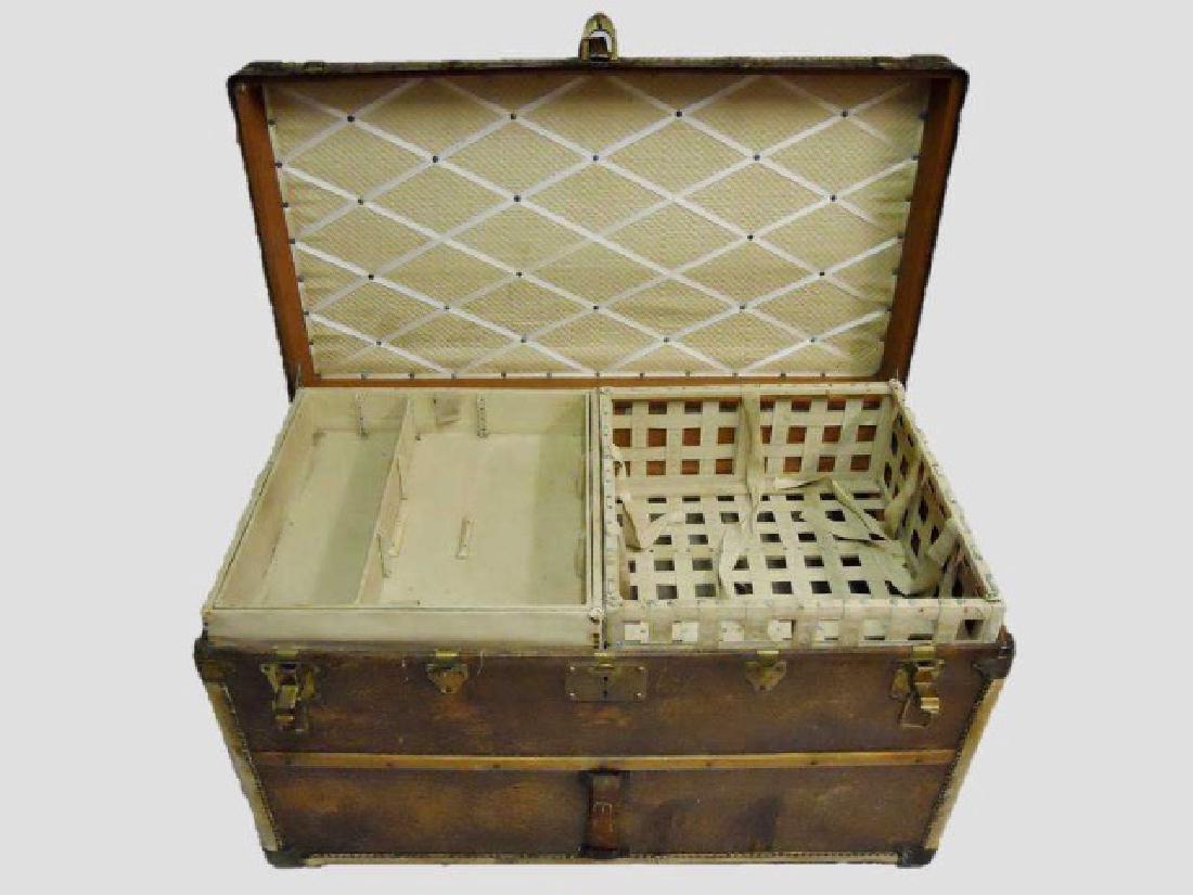 Antique Steamer Trunk, Louis Vuitton: Antique courier trunk by Louis Vuitton, leather and wood construction with brass hardware, leather straps and handles. Faded monogram at left side, "HRK." Four interior compartments, one with embroide