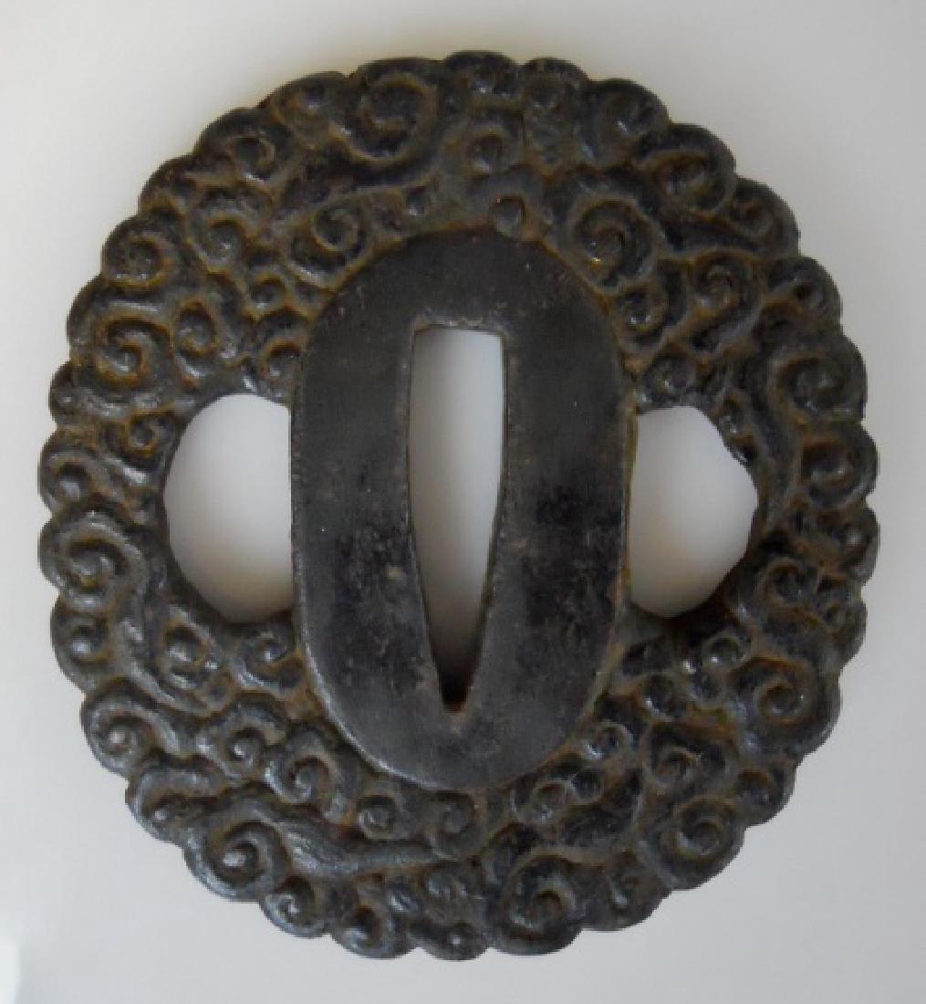 Japanese Edo Period Samurai Sword Tsuba, Signed: Japanese Edo Period tsuba in relief cloud pattern. Tsuba with two character Kanji signature. Measures 2.5" D
