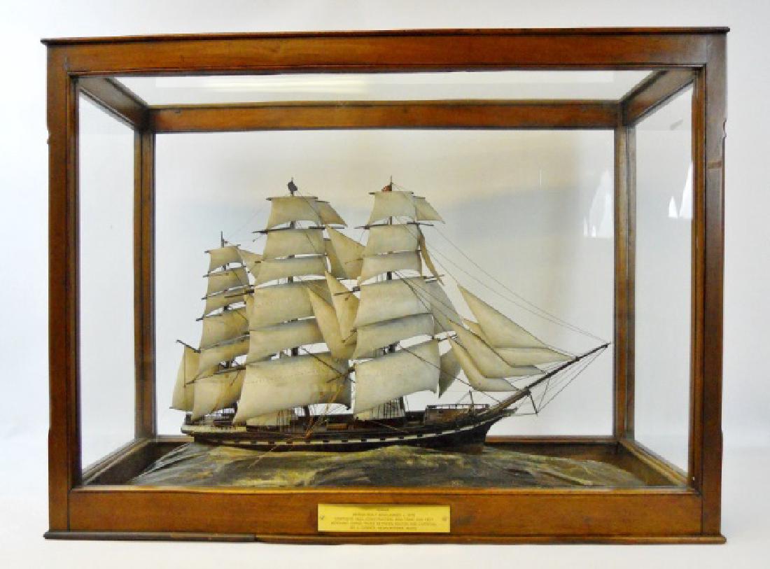 Antique Ship Model, Windjammer 'Queen', J. Currier: Late 19th century antique ship model housed in period glass display case. Highly detailed with carved wooden sails, rigging and deck house with accurate, authentic hull lines. Ship rides on a sea craf
