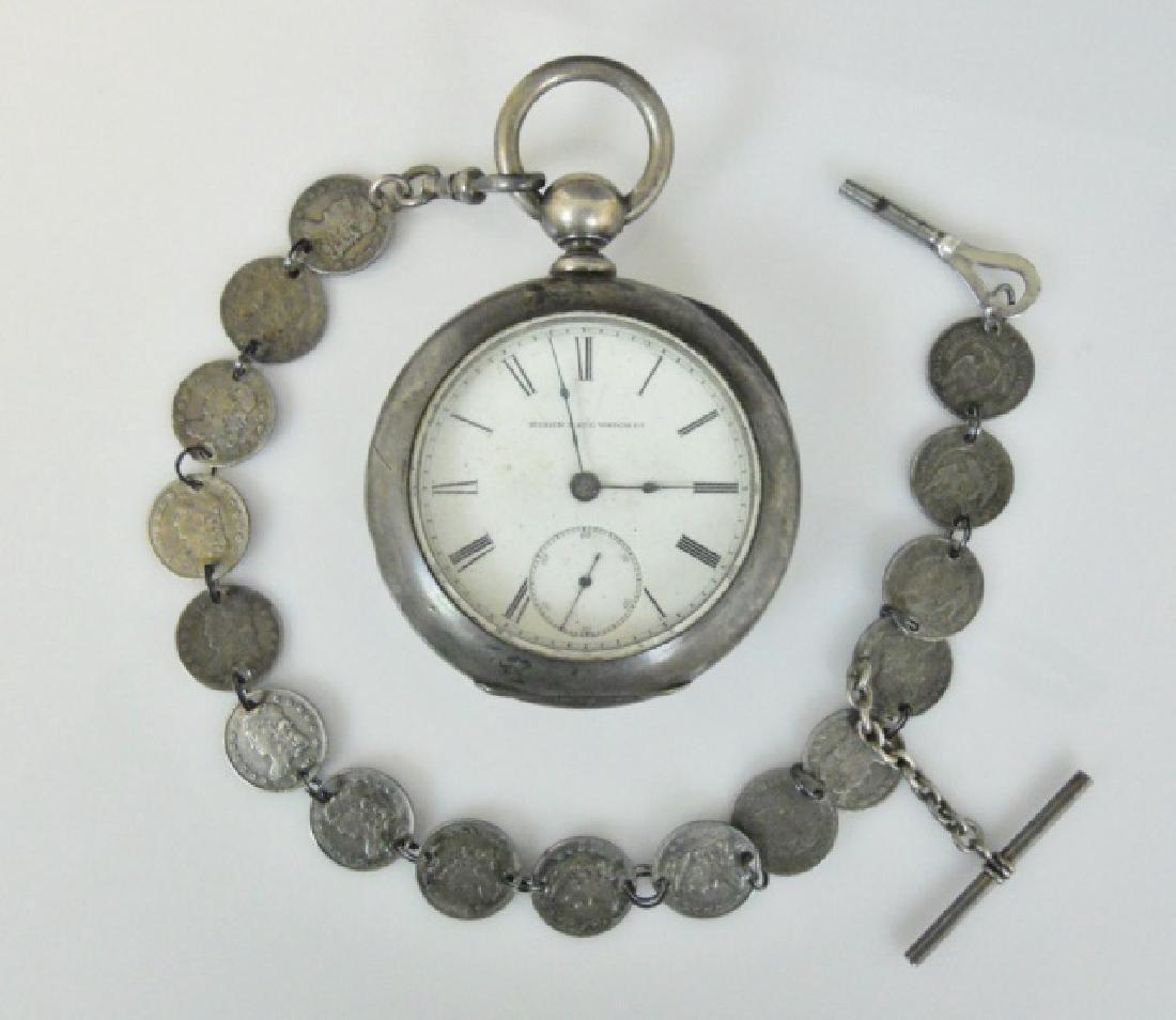 19th C. Silver Pocket Watch, US Coin Chain, Elgin: 19th C. Coin silver key wind pocket watch, Elgin. White enamel face with Roman numeral radial dial with blued steel spade form hour and minute indicator hands and inset seconds dial. Face signed, "ELG