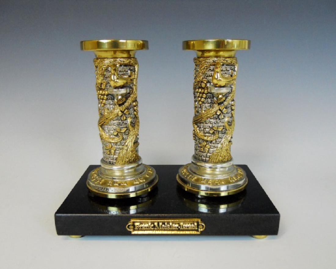 Sterling Grape Pattern Candlesticks, Frank Meisler: 20th Century sterling silver candlesticks with gold plating, set on black marble base. Grape pattern and Hebrew text in relief. Candlesticks are signed at base, "Frank Meisler - Israel." Sticks measur