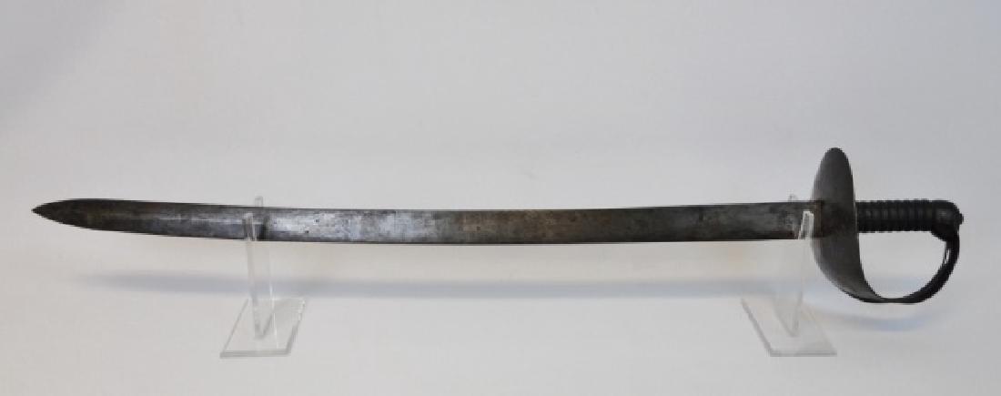 Model 1845 British Royal Navy Cutlass: British M1845 Royal Navy cutlass with heavy curved blade without fuller, it is unmarked. Heavy steel guard, ribbed cast metal grip. Sword measures 35" L, blade measures: 28.5" L.